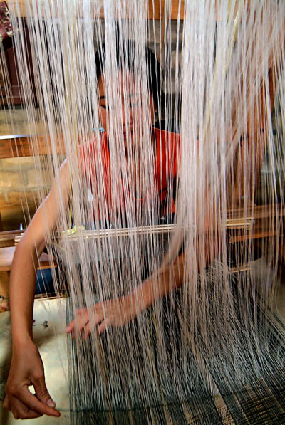 weaving Mulberries silk on a traditional loom